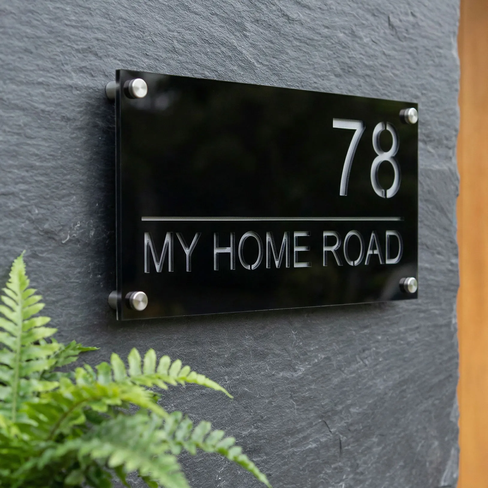 House number 78 plaque on stone wall